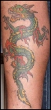 Drachen Tattoo Motiv Ed Hardy an der Wade